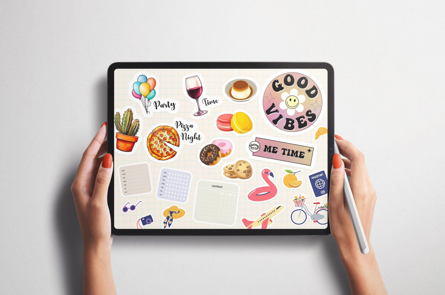 Hands holding an iPad with an Apple Pencil, screen displaying a colorful digital planner page decorated with stickers of food, drinks, travel icons, and positive messages like ‘Good Vibes’ and ‘Me Time.’