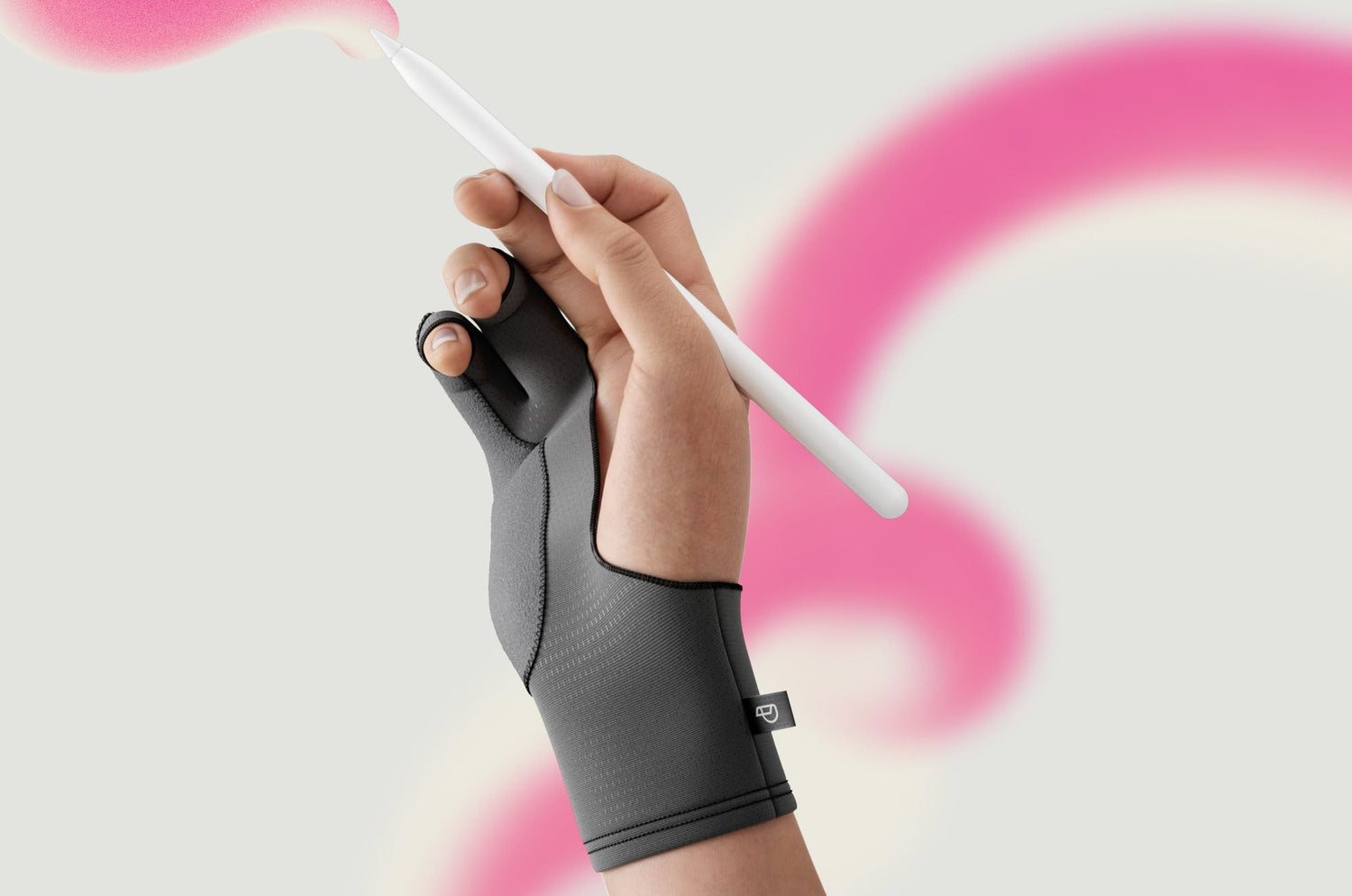 Close-up of a hand wearing a Paperlike™ Drawing Glove, holding an Apple Pencil and creating a pink brush stroke on a light background.”