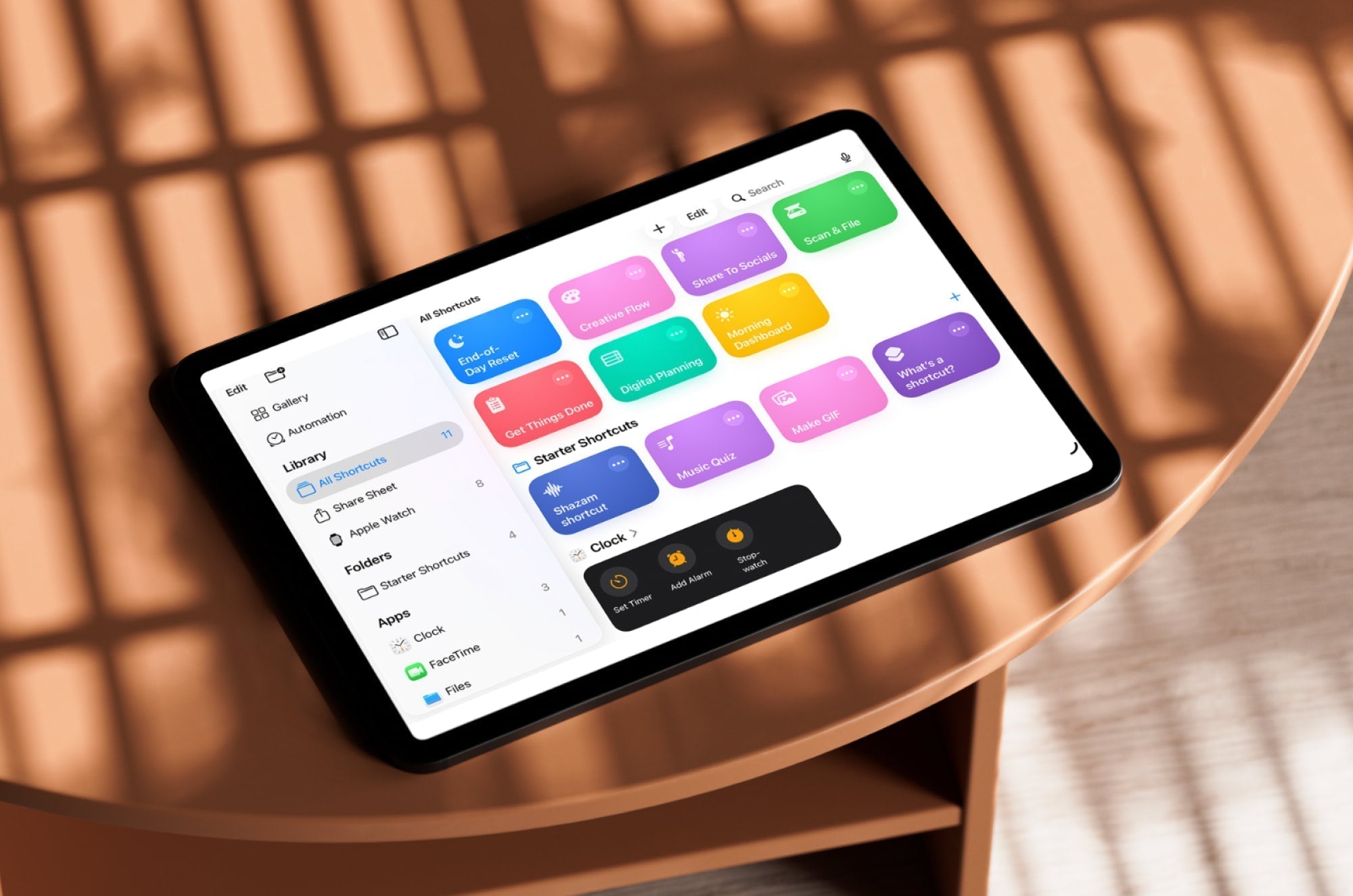 An iPad on a table with the Shortcuts app open on the screen.