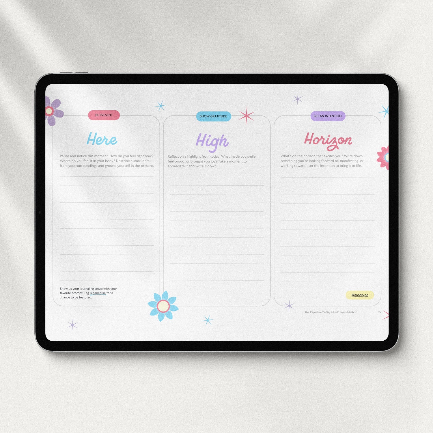 Tablet displaying a journaling page from 'The Paperlike 15-Day Mindfulness Method' titled 'Here, High, Horizon'. The page includes three columns with prompts to be present, show gratitude, and set an intention, decorated with colorful flowers and stars.