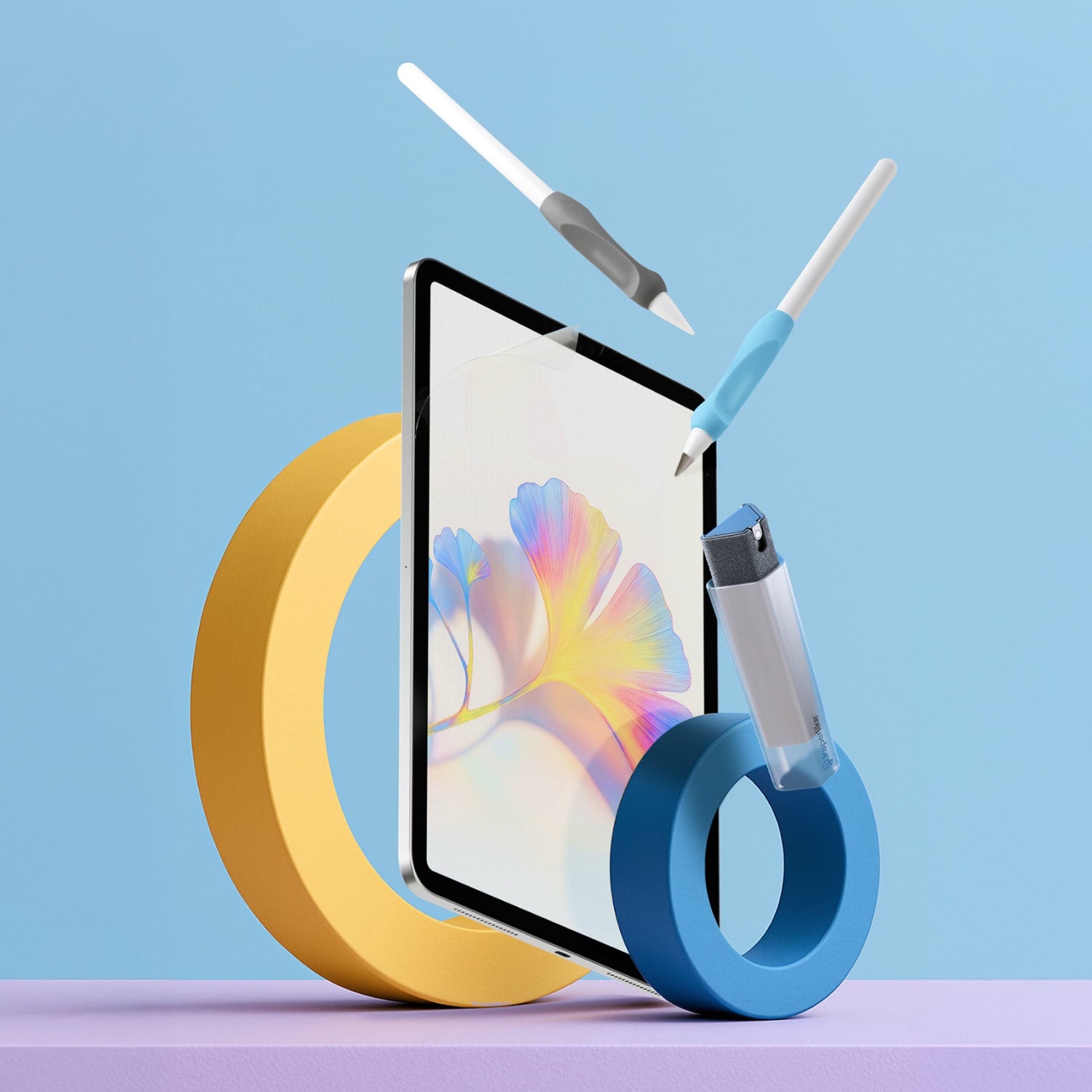 A picture of Paperlike's Screen Protector, Pencil Grips, Pencil Tips, and Cleaning Kit floating in front of a Paperlike blue background.