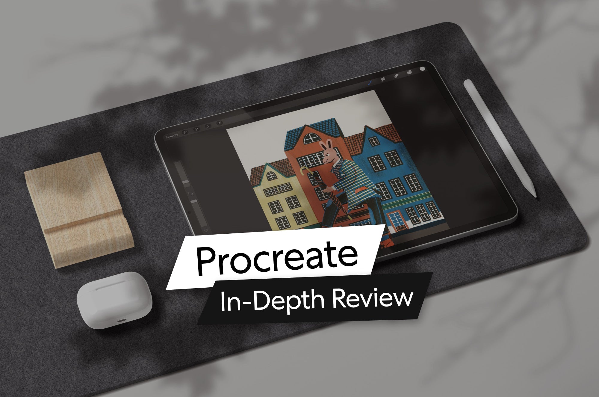 iPad with Procreate open on screen showing colorful digital illustration of houses and a rabbit character, with Apple Pencil beside it and text overlay reading Procreate In-Depth Review.