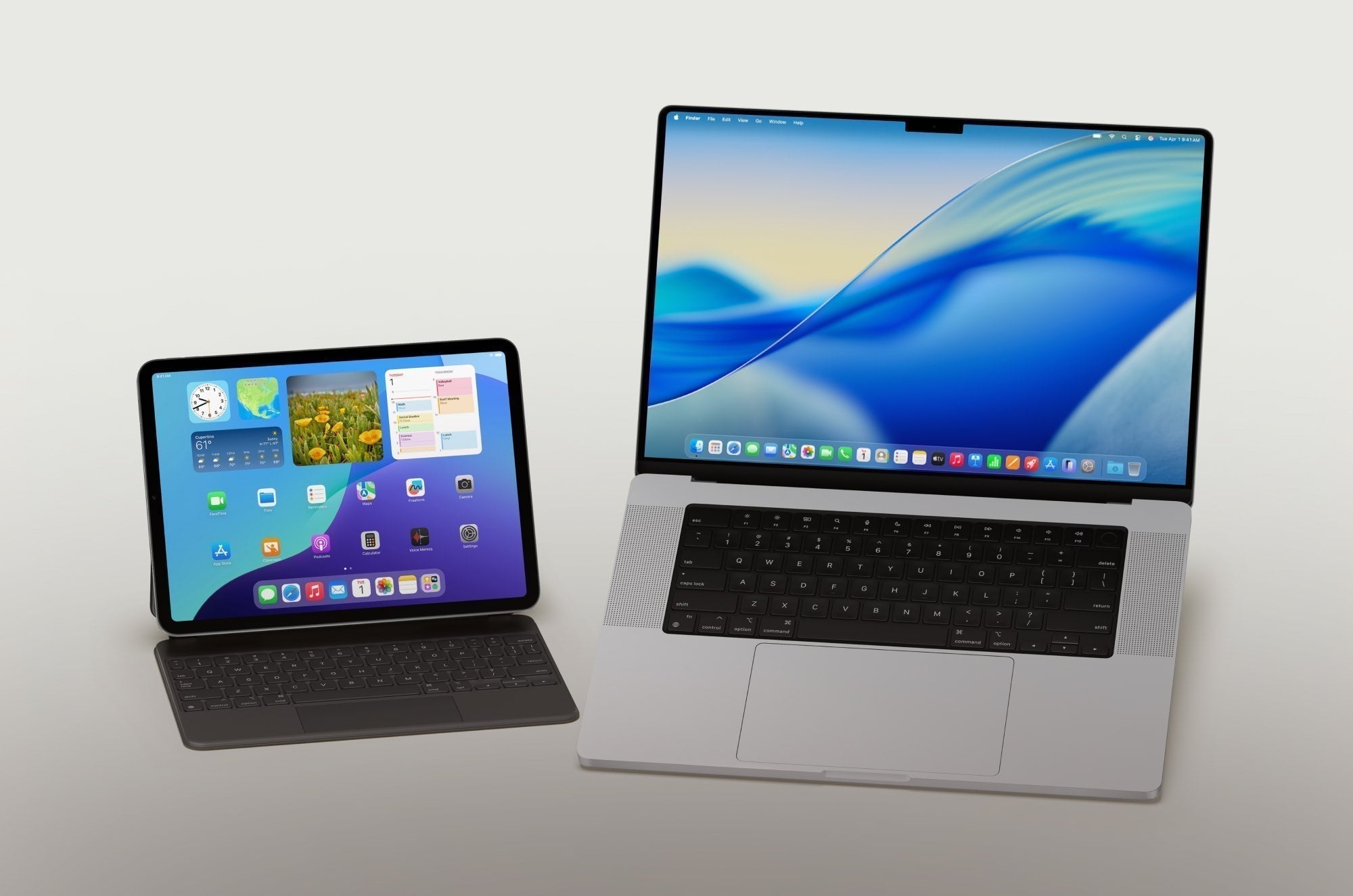 A MacBook and an iPad sitting next to each other.