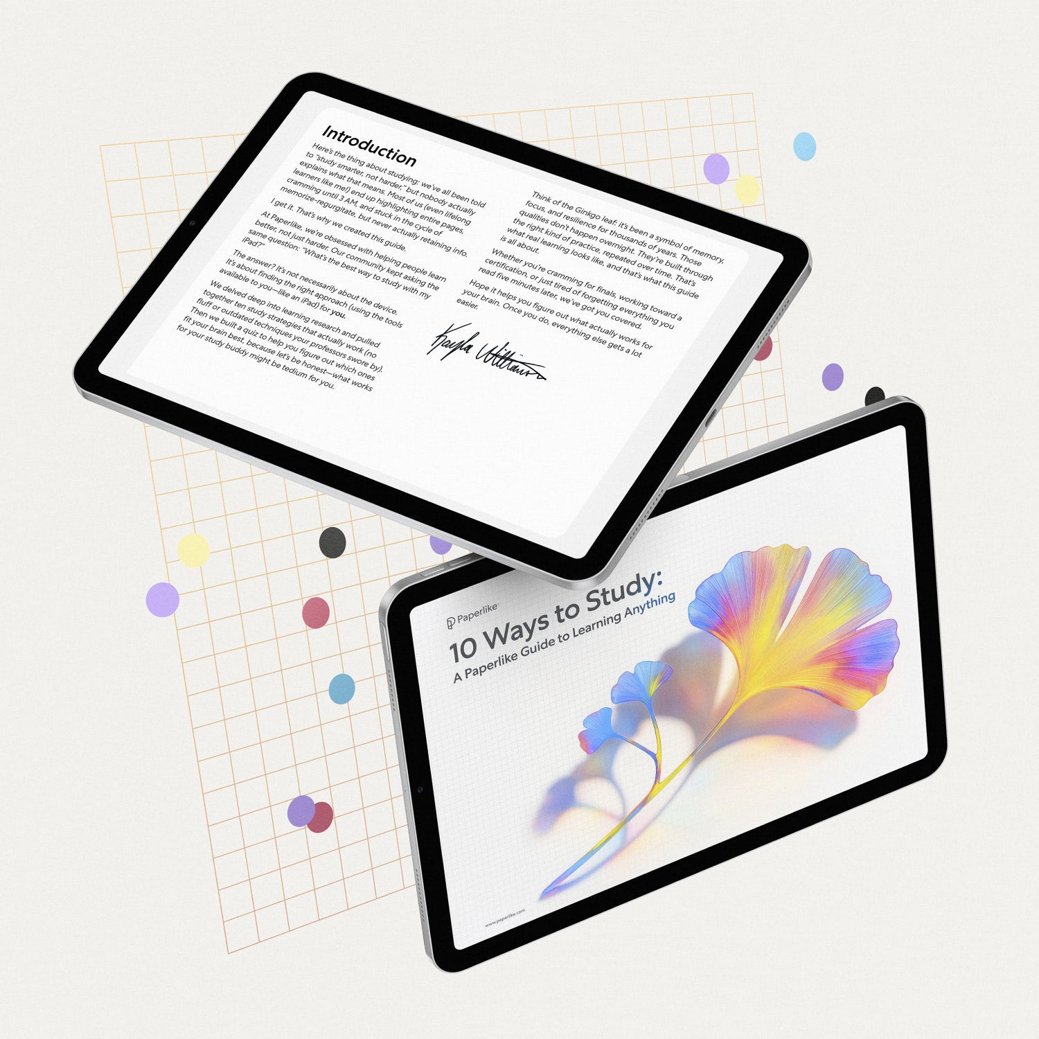 Two digital tablets float above a clean, white background decorated with a subtle orange grid and scattered colorful paper dots. One tablet displays the vibrant cover of the eBook "10 Ways to Study: A Paperlike Guide to Learning Anything," featuring a rainbow-toned ginkgo leaf. The other tablet shows the eBook’s introduction page with a welcoming message and a signature from the author. The overall composition is bright, playful, and visually inviting.