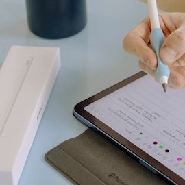 Apple Pencil case and iPad with Paperlike accessories like Pencil Grip and Folio Case.