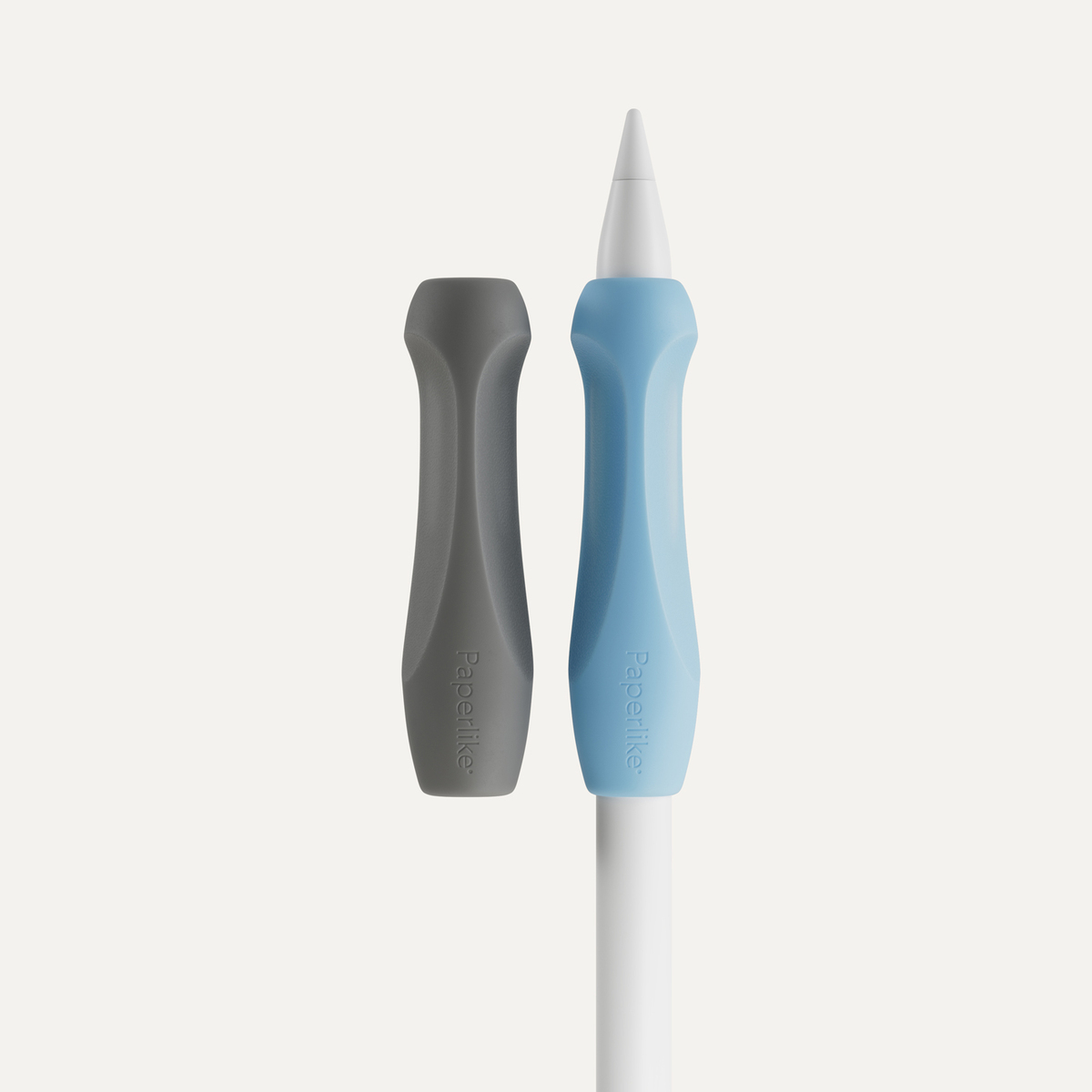 Two Paperlike pencil grips and an Apple Pencil